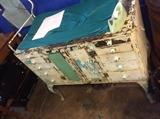 This may have been an old dental or doctors cabinet, I think it metal, love the paint! 