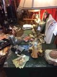 Check out this top on what I assume is a metal table. I need to get back there and take a closer look. Granite or rock grinder, Italian lamps, and not sure what the bird is made of? 