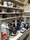 Many small appliances and mugs
