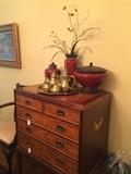 Five-drawer storage chest, decorative items, and brass tea/coffee set