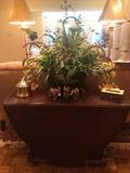 Drop leaf table, matching lamps, and one of the many attractive floral arrangements