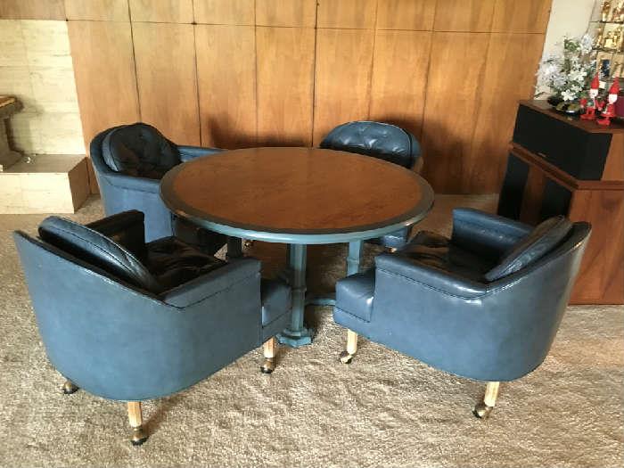 Mid century Game table and 4 leather chairs. Excellent original condition.