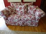 Pottery Barn red floral loveseat