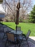 Outdoor patio table, chairs and umbrella