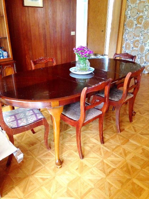 mahogany dining table and antique dining chairs