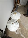 2 umbrella stands with umbrellas