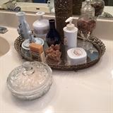 Dusting powder. Perfumes tray, vanity items. Nice hamper.  