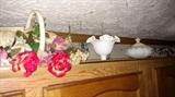 Collectibles and flower arrangements