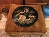 Lacquered Dragon tray. Wild cat ottoman.
