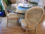 Glass topped dining set with six chairs.