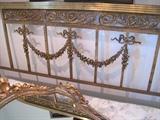 A French Louis XVI style brass bed.