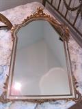 Ornate gilt mirror.