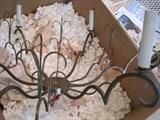 Brass and crystal chandelier just waiting to be assembled.