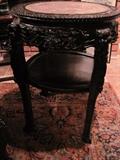 We have three of these rosewood and marble tables, this is the largest of the three.