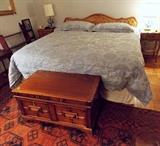 French Provincial Bed and Nightstands that match the chest-of-drawers. Chest at the foot of the bed is 18th Century.