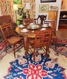 Walnut French Provincial breakfast table. It is the perfect size. Also, note the rich, beautiful rugs throughout the estate.