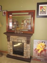 Fire place w/ heater, antique mirror w/ shelving, wall art 