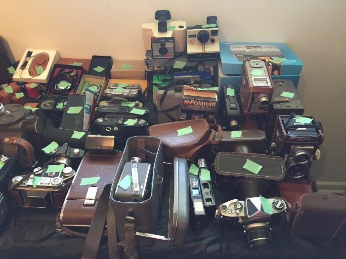 Large collection of antique cameras, lenses and developing equipment