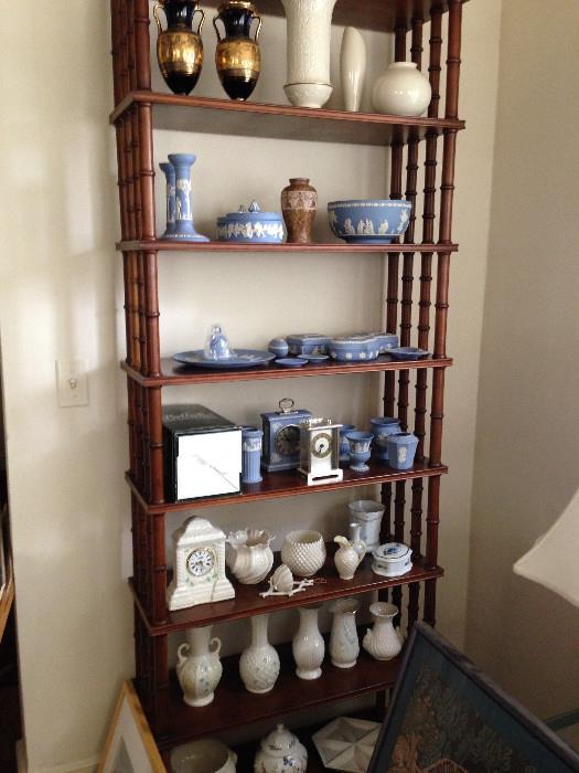 Bamboo style shelving unit full of collectible ceramics