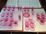 West German cranberry crystal stemware. Sold all together, or in separate sets. Water goblets, sherbet/dessert, cocktail glasses, wine & sherry glasses