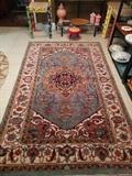 Hand Woven, 100% wool Heriz design rug, beautiful colors, measures 5' x 8'.
