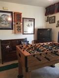 Bench, Foosball, art work, small display cabinets, model cars