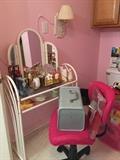 Make-up table, pink chair, vintage case, perfumes