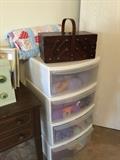 These plastic drawers contain lots of wool, sewing basket