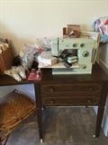 Montgomery Ward sewing machine in table, sewing supplies