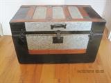 Vintage wood and metal covered decorative trunk.
