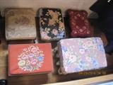 A beautiful collection of antique and vintage footstools. Some with wood, cast-iron or brass legs. some have hand-done needlepoint top cushions.
