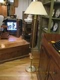 Brass stand-up lamps.