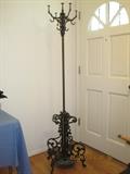 Pre 1900 antique iron coat, hat, and umbrella stand. Very ornate and heavy. This is a family piece that was in the great-great grandmothers home before 1900.