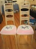 A pair of highback chairs