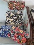 Lots of Vera Bradley quilted handbags and totes