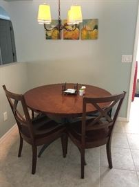 Ethan Allen table make into a round table without leafs