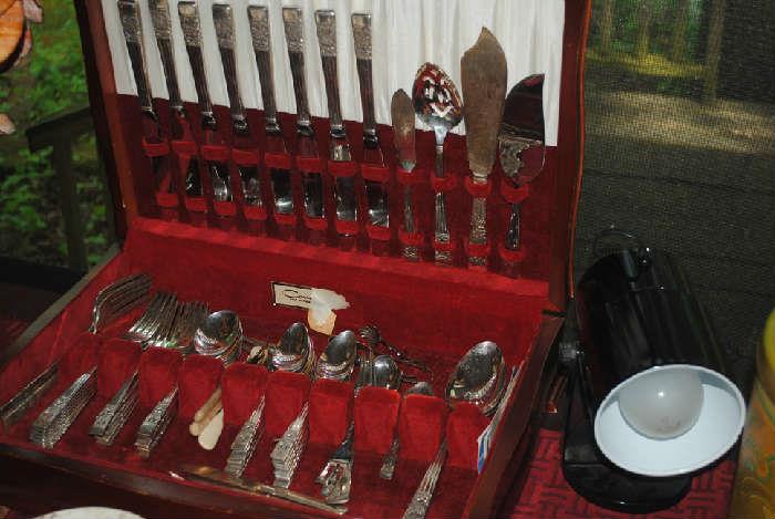 Silver plate flatware with serving pieces. 