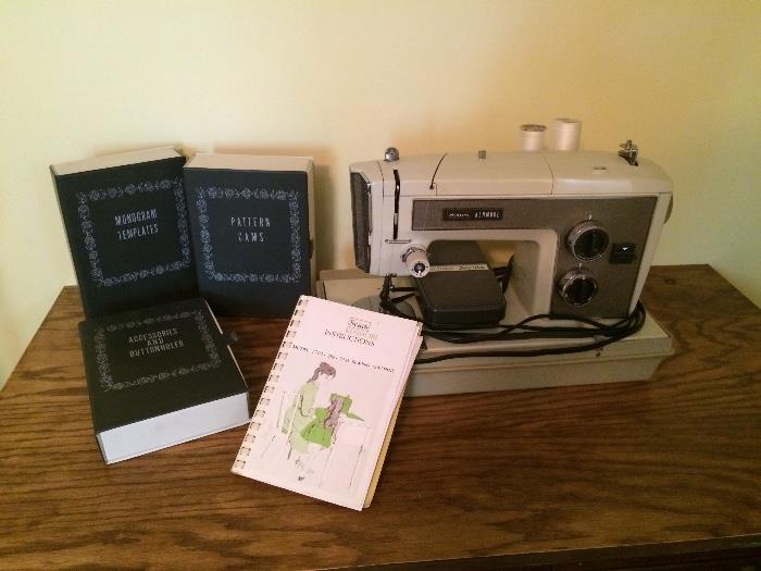 Kenmore zig-zag sewing machine. Model 1703 with owners manual and Monogramming accessories.