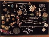 Costume jewelry includes designers Carnegie, Mizpah, Coro, Napier, Trifari, Sandor.
