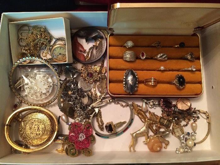 Collection of jewelry includes bracelets, necklaces, earrings, rings, cufflinks, pins, watches, tie-tacks.