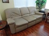 either end is a recliner and it tan leather.. great buy