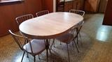 Retro Dining Table with Formica Top and 5-Wire Frame back Chairs with padded seats.