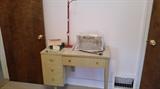 Vintage Single Pedestal Sewing Table with drawer & Singer Sewing machine.