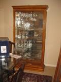 Beautiful display cabinet with door that slides to either side