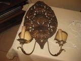 pair of large metal wall sconces with lights