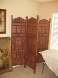 large ornate cutwork wooden screen