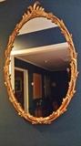 Oval mirror with beautiful gold frame.