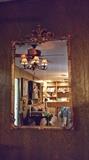 Mirror with ornate gold frame
