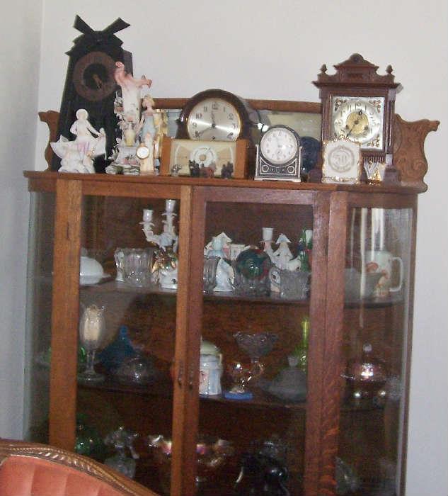 OLD CURVED GLASS CABINETS LOADED WITH CARNIVAL GLASS, FIGURINES, GLASSWARE AND CLOCKS!