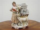German bisque, painted porcelain figurine of a farmer's wife with goat. Dates back to 1910-1920's. Main in Germany... perhaps by Gebruder Heubach. 
